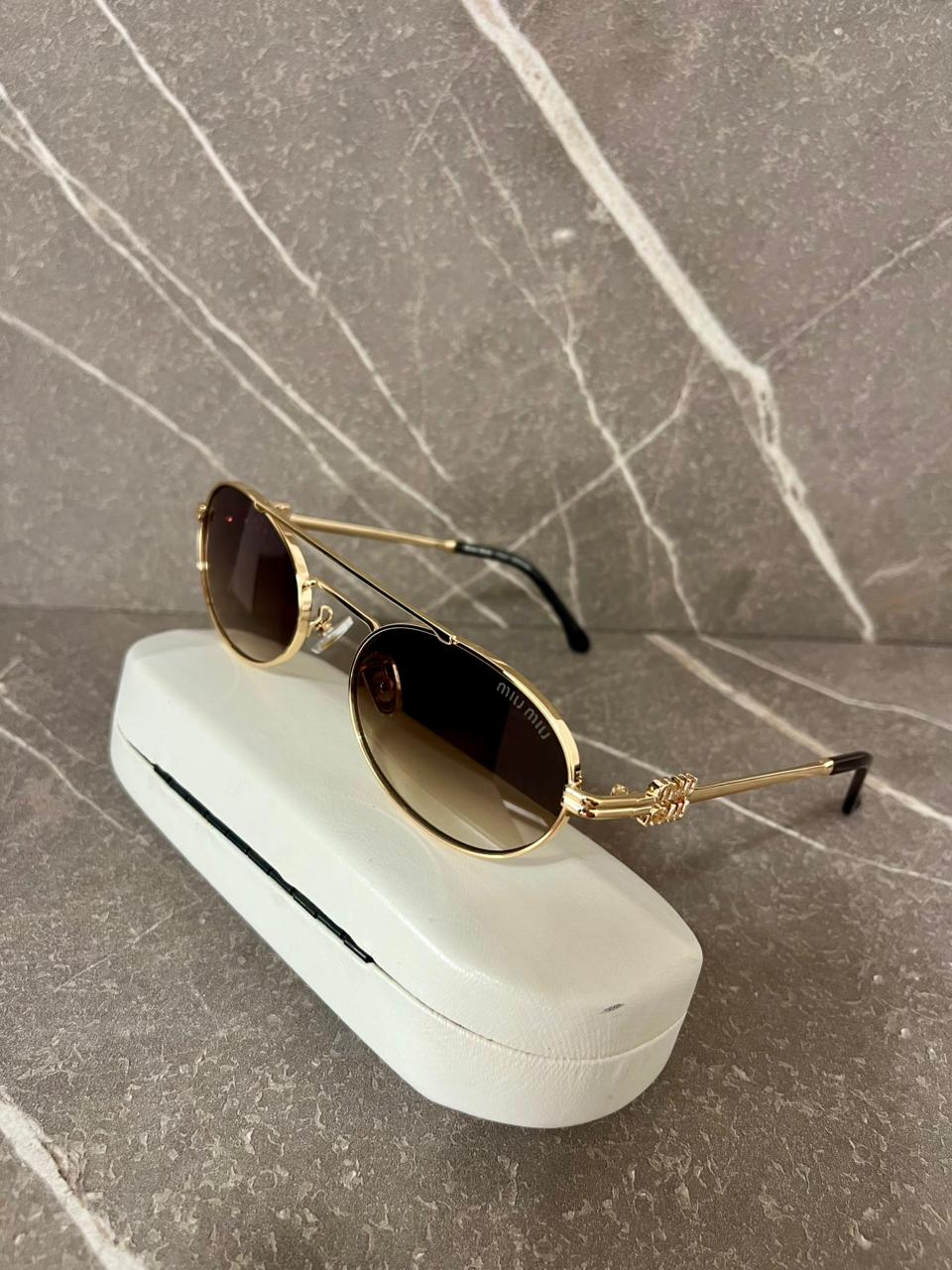 Gafas de sol Miu Miu  Metálicas Ovaladas