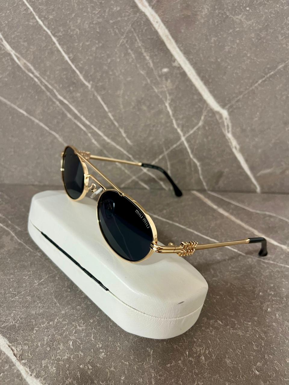 Gafas de sol Miu Miu  Metálicas Ovaladas